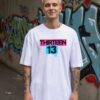 Madingiausi oversized marškinėliai su spauda Thirteen